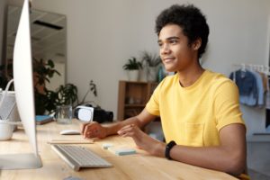 man studying online